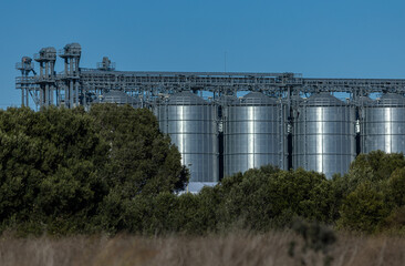 Industrial storage tanks and silos in modern industrial facility in Sagunto, Valencia, Spain.
