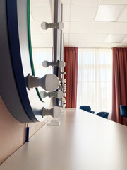 Modern vanity mirror with bright bulbs reflecting natural light, showcasing elegant design elements and a stylish atmosphere in a contemporary interior space