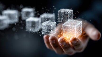 A hand cradles glowing, translucent cubes amidst a dark background
