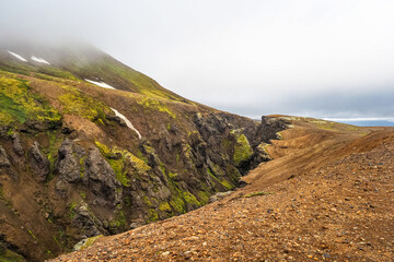 Wild Icelandic landscape. Deep canyon with steep cliffs, next to road F347, on the way to the highlands, Kerlingarfj&ouml;ll volcanic mountain range and Hveradalir. Hrunamannahreppur municipality, Iceland.