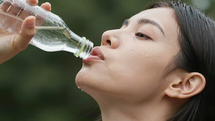Woman Drinking Water After Workout