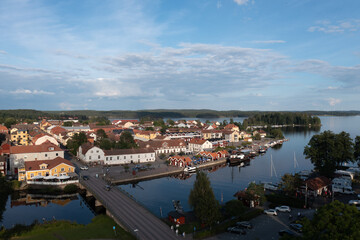 Obraz premium Aeiral view of a Swedish village at a lake with boats