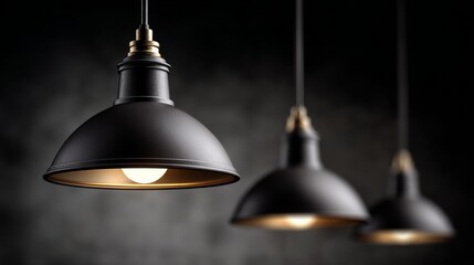 Obraz premium Elegant black pendant lights hanging from ceiling, illuminating a stylish interior space with a soft glow, creating a warm and inviting atmosphere for modern design enthusiasts