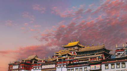 Songzanlin Monastery at sunset with golden light, Shangri-La, Tibet, China