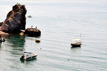 Seascape. Small boats and motorboats are moored in a picturesque bay.