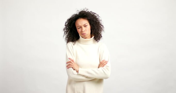 Skeptical african american woman showing disapproval