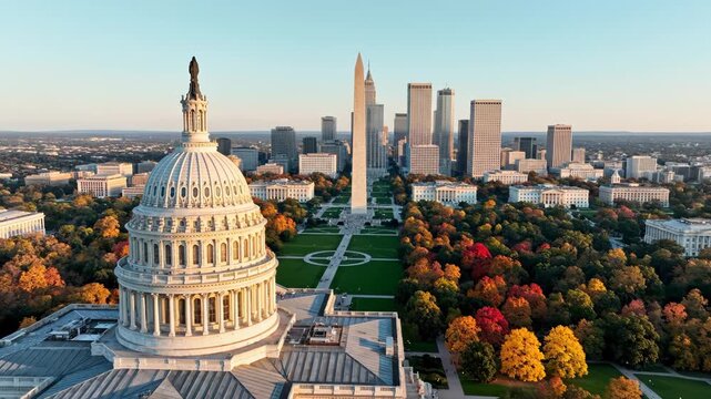 Capitol building with autumn trees and city skyline