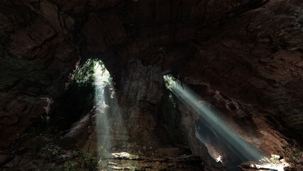 Obraz premium Dramatic light shafts piercing dark cavern, dust motes visible in beams, wet stone floor reflecting glow, cathedrallike spaces and quiet echo, mystical