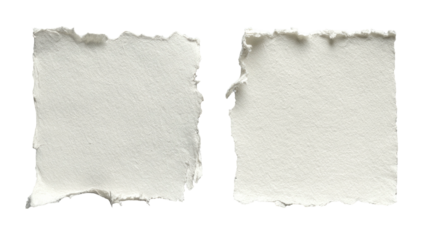 Two square, torn pieces of white paper isolated on a black background