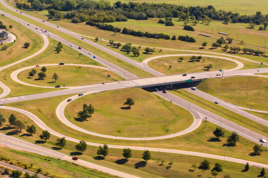 Aerial view of a large highway turnoff,  intersection, with exit roads in circles.