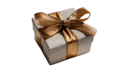 A small, wrapped gift box with a textured exterior and elegant, golden ribbon bow