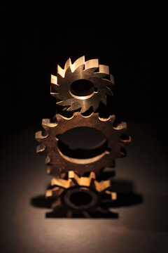 Three stacked cog wheels with different gearing.