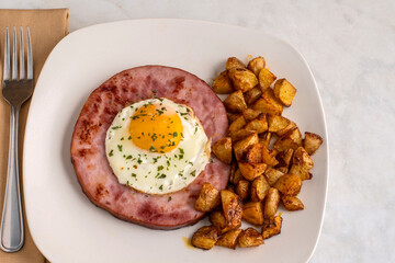 fried egg with fried   ham and  home fries