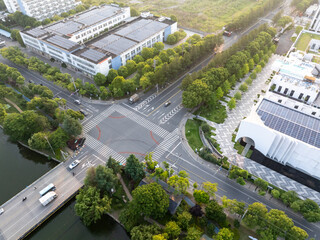 road through modern city with tree around