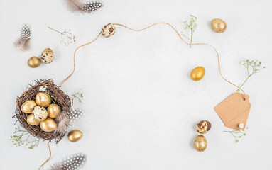 Elegant Easter flat lay with golden eggs in nest, spring decor and copy space on white background