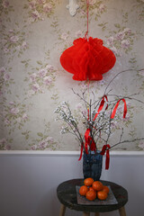 Living room decorated for Chinese New Year with red lanterns and oranges