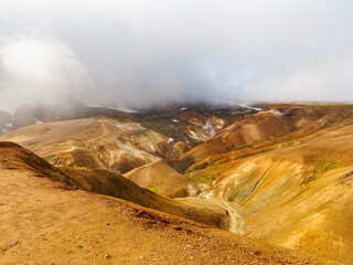 Sulphur smell valley with small river. Beautiful Highlands, Kerlingarfj&ouml;ll colorful mountain peaks and Hveradalir geothermal area in Iceland. Wild Icelandic landscape. Hrunamannahreppur municipality.