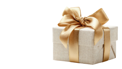 A square present box wrapped in beige fabric, adorned with a large, golden ribbon and bow