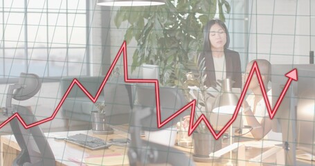 Presenting office team in business casual attire analyzing screens and laptop at desk, red overlay