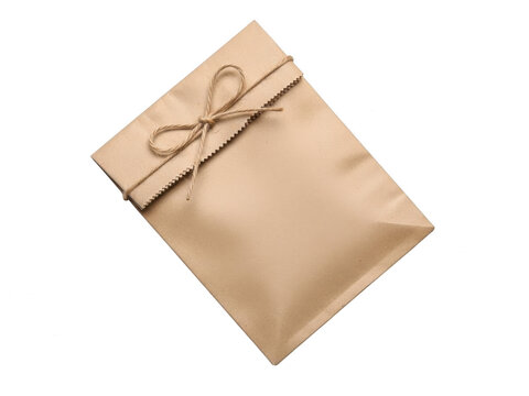 Brown paper gift bag with bow, isolated on transparent background