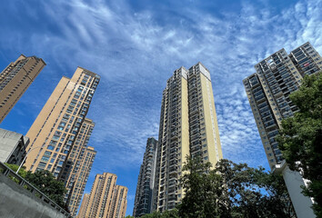 Modern Residential Towers with Blue Sky and White Clouds © HoangNgoc