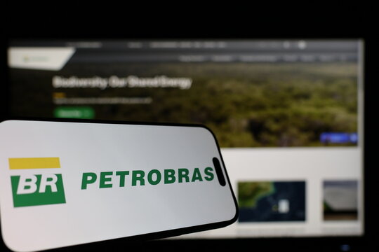 Kiel, Germany - 01-12-2026: Smartphone displaying Petrobras logo in front of the company website on a monitor