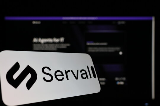 Kiel, Germany - 01-12-2026: Smartphone displaying Serval logo in front of the company website on a monitor