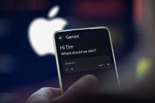 Gemini AI application on a phone, in the blurred background the logo of Apple.