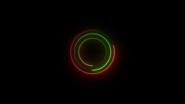 Three concentric neon rings in red green and yellow glowing brightly on a dark black background representing a warning signal or a cyclical process in technology