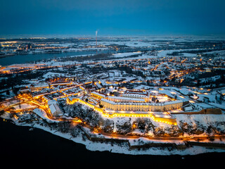 Aerial Sunset View of Petrovaradin Fortress Covered in Snow over the Danube River, Novi Sad, Serbia