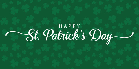 Festive green background with shamrocks and decorative happy st. patrick's day text for holiday celebration design