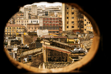 Panoramic View Over Ragusa From Cathedral Of San Giovanni Battista: Historic Sicilian City Rooftops, Church Domes, And Dense Stone Architecture Under Overcast Sky