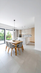 Fototapeta premium Helles, modernes Wohnküchen-Interieur mit Essbereich und viel Tageslicht