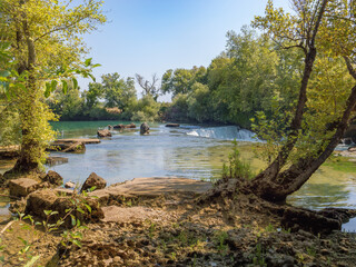 Fototapeta premium Scenic Turkish Getaway: Wide shot of Manavgat Waterfall near Side and Antalya, a peaceful natural landmark. Evoking Peace and Tranquility.