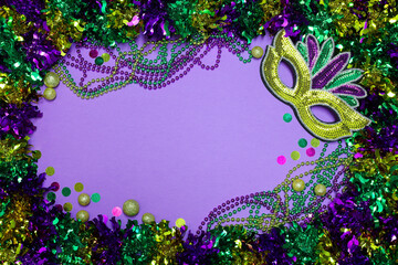 Mardi Gras background with copy space and vibrant colors and festive decorations.