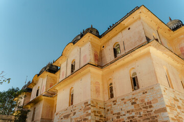 Majestic Facade of an Ancient Indian Palace Against a Clear Sky: Captivating Architecture and Heritage, Perfect for Travel, History, and Culture Promotion