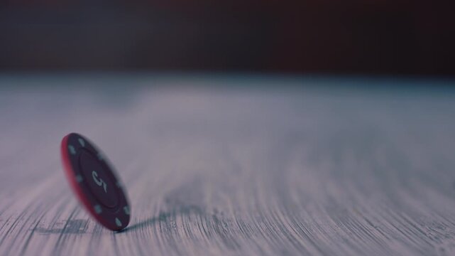 Poker chip spinning on table