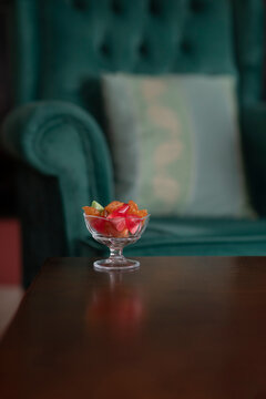 Close-up of Traditional Akide Şekeri in Crystal Bowl on Green Velvet Armchair