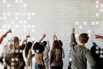 Rearview of diverse people pointing to a blank white wall