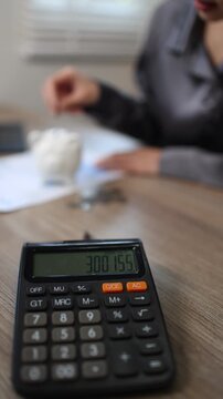 Person inserting coin into piggy bank, symbolizing saving, investment, financial growth, security, future planning, wealth, banking, and smart money management.
