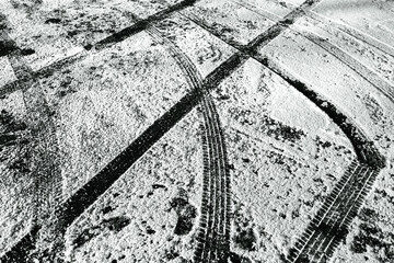 Tire tracks in the snow that could be a background
