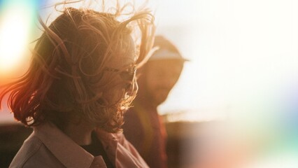 Woman strolling around with her friend in harsh winds