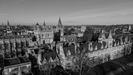 Aerial view of historic Christ Church College and Oxford city spires under a clear sky