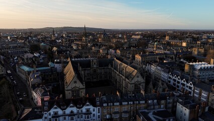 Oxford cityscape aerial view showcasing historic University buildings under a clear sky