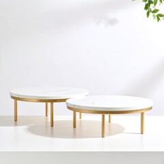 Two elegant white marble tables featuring sleek gold legs, showcasing a modern design that adds sophistication to any interior space or decor.