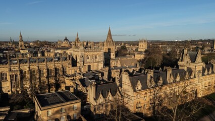 Oxford cityscape showing historic university buildings and rooftops under a clear sky