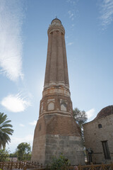 Yivli Minaret of Antalya standing tall against a clear blue sky