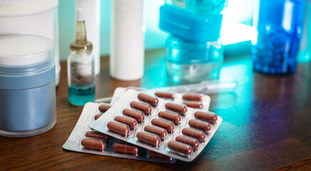 many different medications on a medical background in blue tones