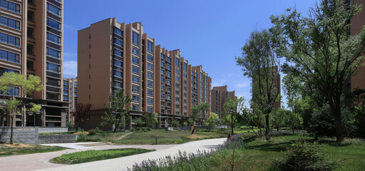 Modern Residential Complex with Landscaped Green Spaces and Apartment Buildings © LyVan