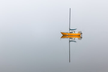Yellow Sailboat in the Fog
